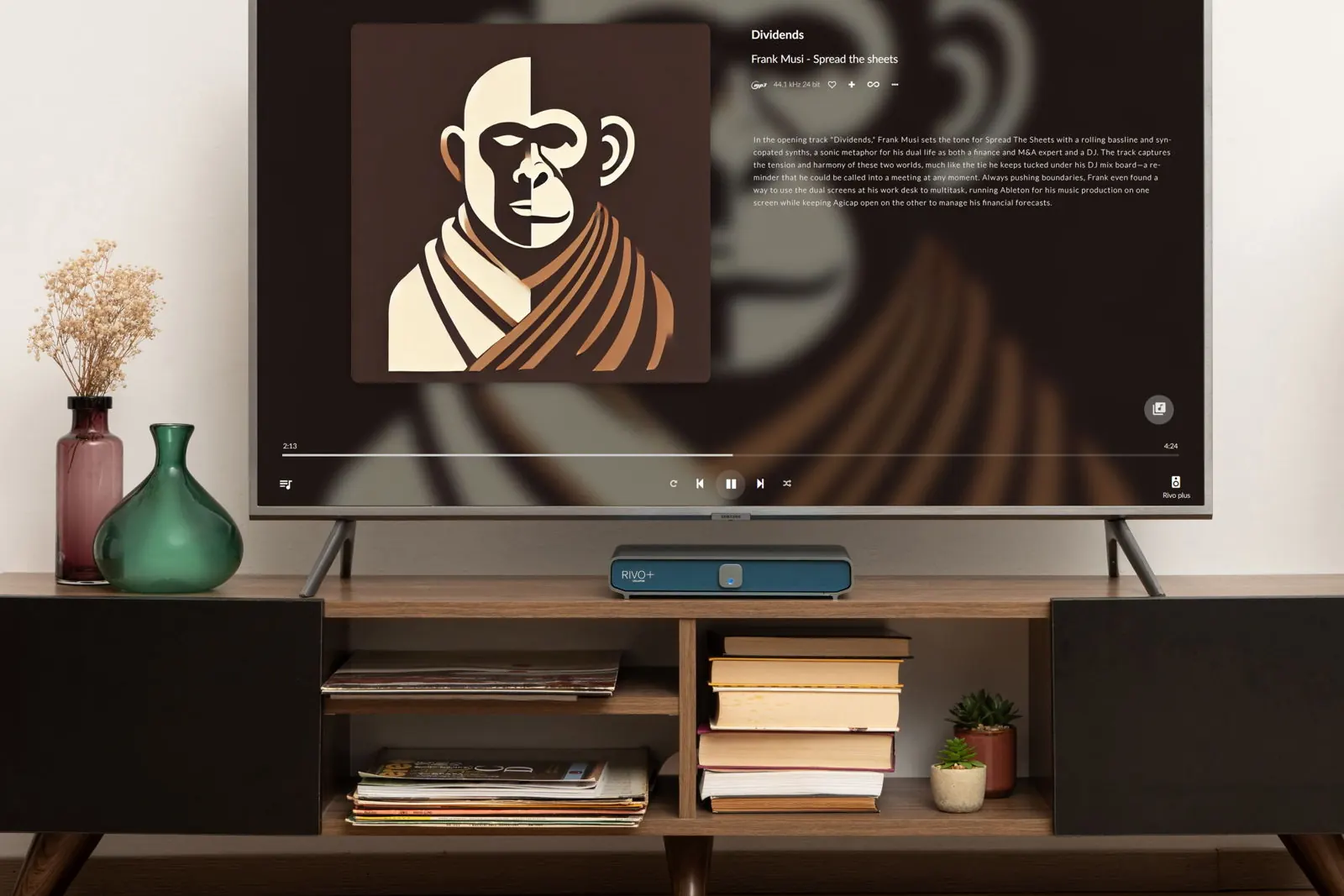 A living room with a TV showing album art and track details, above a dark wooden sideboard with books, records and Rivo+.